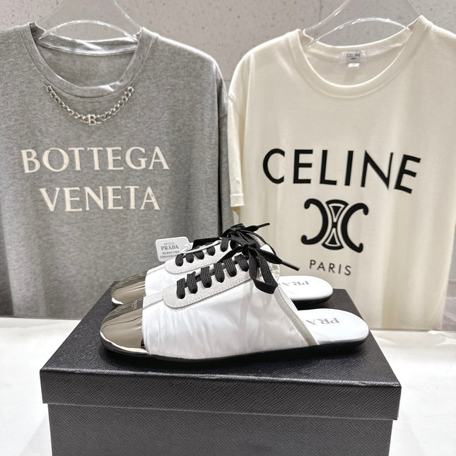 PRADA 25S MULES IN WHITE WITH METAL TOECAP