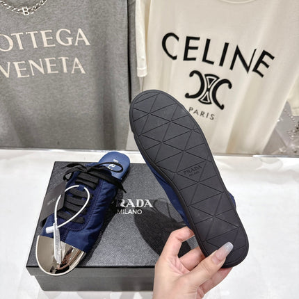 PRADA 25S MULES IN DARK BLUE WITH METAL TOECAP
