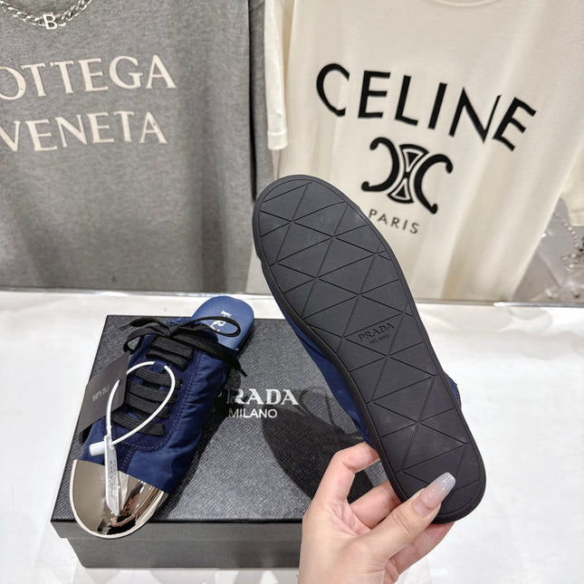 PRADA 25S MULES IN DARK BLUE WITH METAL TOECAP
