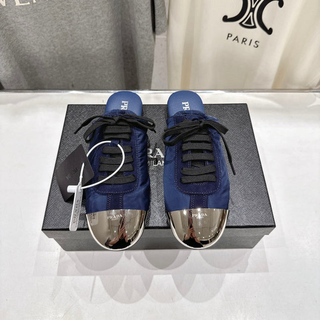 PRADA 25S MULES IN DARK BLUE WITH METAL TOECAP