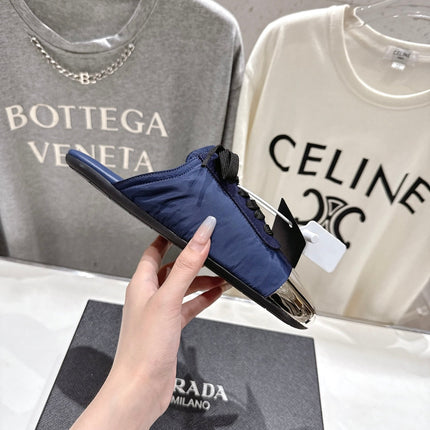 PRADA 25S MULES IN DARK BLUE WITH METAL TOECAP