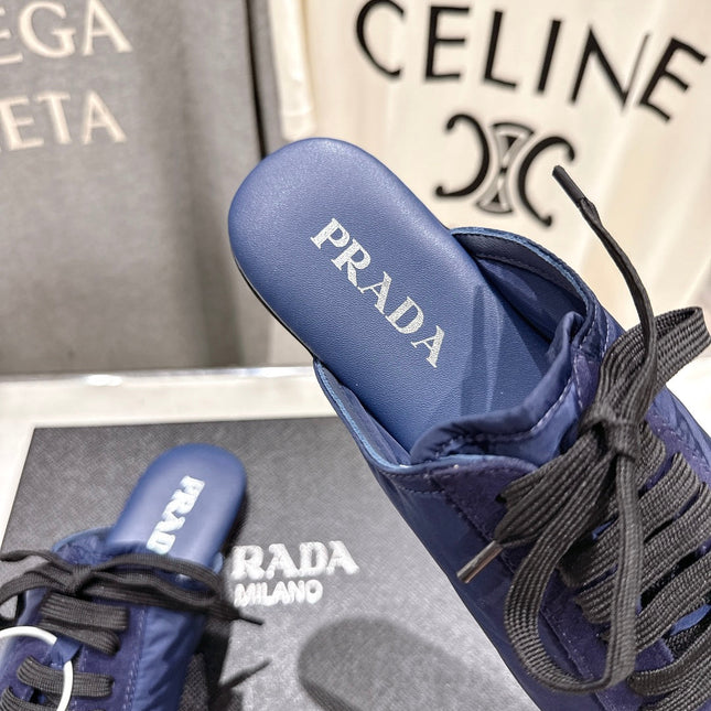 PRADA 25S MULES IN DARK BLUE WITH METAL TOECAP