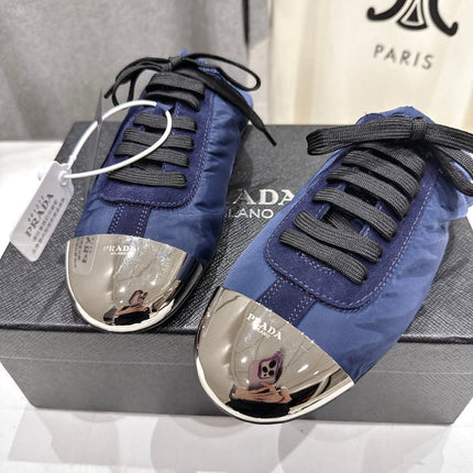 PRADA 25S MULES IN DARK BLUE WITH METAL TOECAP