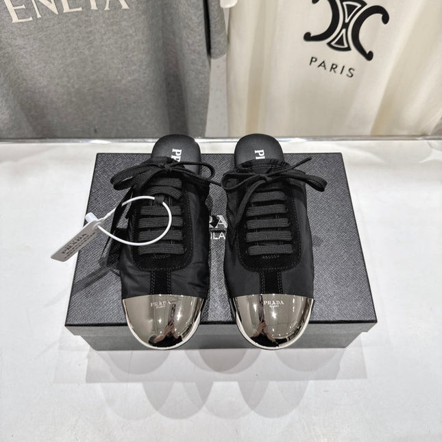 PRADA 25S MULES IN BLACK WITH METAL TOECAP