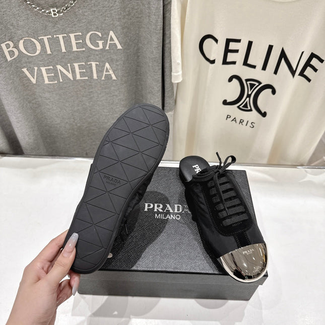 PRADA 25S MULES IN BLACK WITH METAL TOECAP