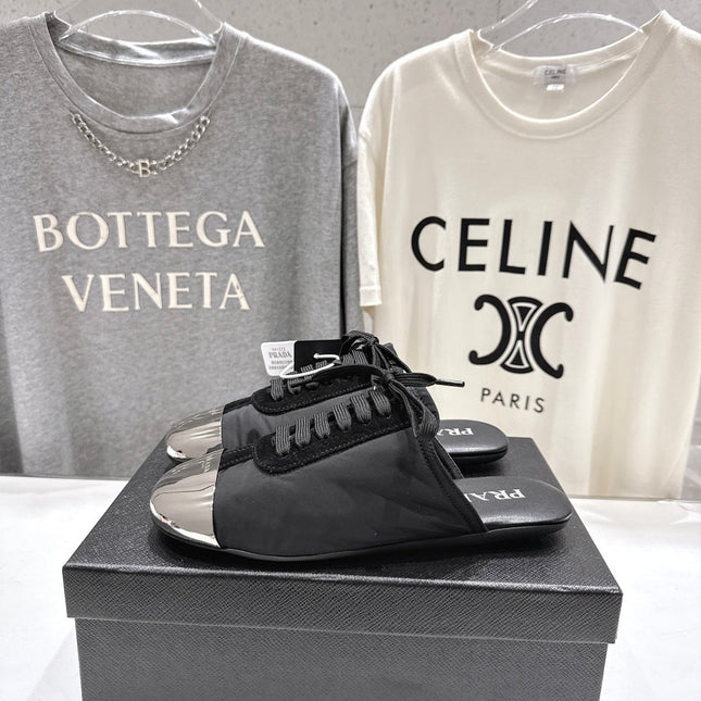 PRADA 25S MULES IN BLACK WITH METAL TOECAP