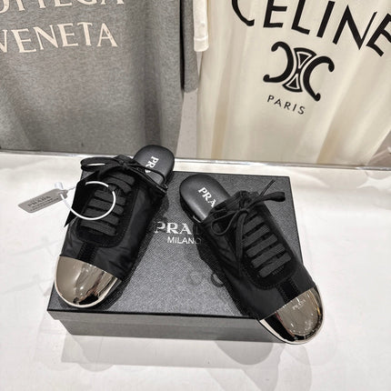PRADA 25S MULES IN BLACK WITH METAL TOECAP