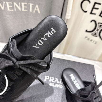 PRADA 25S MULES IN BLACK WITH METAL TOECAP