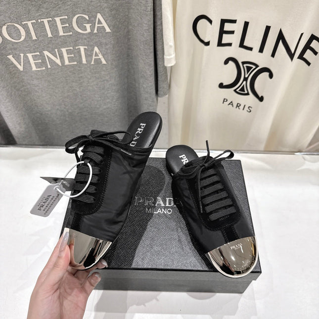 PRADA 25S MULES IN BLACK WITH METAL TOECAP
