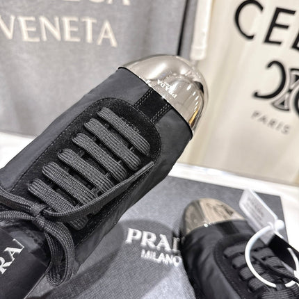 PRADA 25S MULES IN BLACK WITH METAL TOECAP