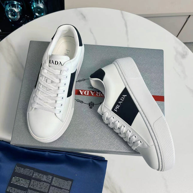 PRADA 25S LEATHER LOGO OUTLET SNEAKERS BLACK AND WHITE CALFSKIN