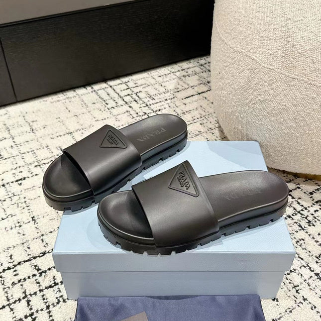 PRADA 25S RUBBER SLIDE IN CHARCOAL CALFSKIN WITH LOGO