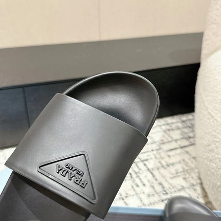 PRADA 25S RUBBER SLIDE IN CHARCOAL CALFSKIN WITH LOGO