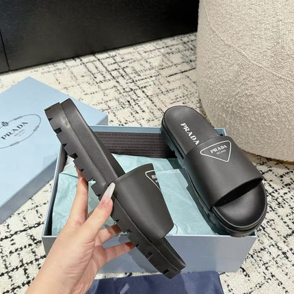 PRADA 25S RUBBER SLIDE IN BLACK CALFSKIN WITH LOGO