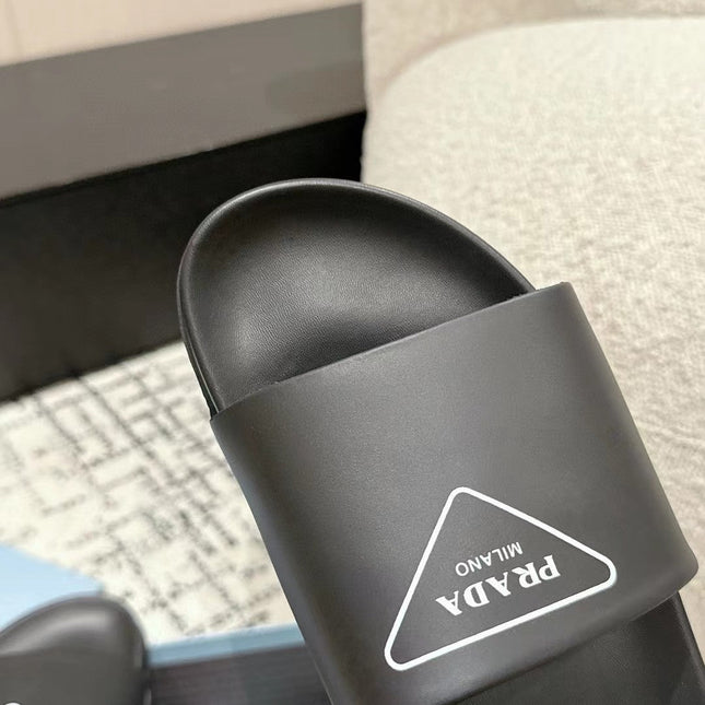 PRADA 25S RUBBER SLIDE IN BLACK CALFSKIN WITH LOGO