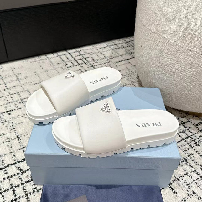 PRADA 25S PADDED SLIDES IN WHITE CALFSKIN WITH LOGO
