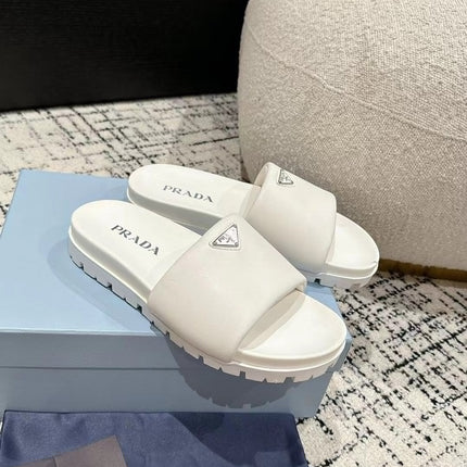 PRADA 25S PADDED SLIDES IN WHITE CALFSKIN WITH LOGO