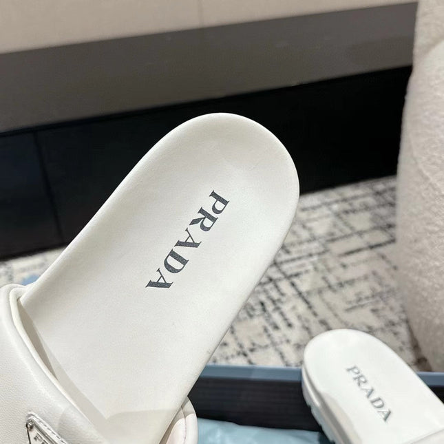 PRADA 25S PADDED SLIDES IN WHITE CALFSKIN WITH LOGO