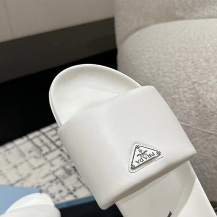 PRADA 25S PADDED SLIDES IN WHITE CALFSKIN WITH LOGO
