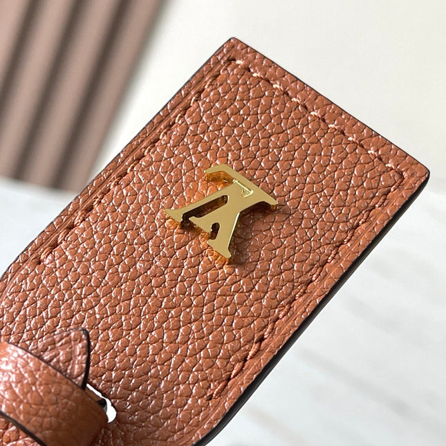 CARRYALL PM 29 IN COGNAC MONOGRAM EMPREINTE LEATHER GOLD LOGO