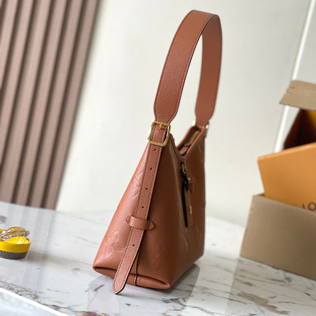 CARRYALL PM 29 IN COGNAC MONOGRAM EMPREINTE LEATHER GOLD LOGO