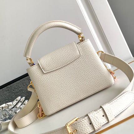 CAPUCINES MINI 21 IN PEARL WHITE TAURILLON GOLD HARDWARE