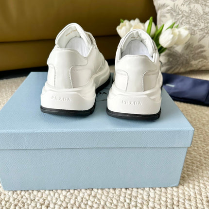 PRA THICK SOLE SNEAKER WHITE AND BLACK LOGO CALFSKIN