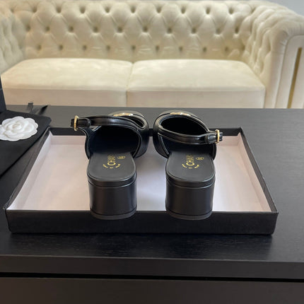 CC SLINGBACKS IN BLACK CALFSKIN