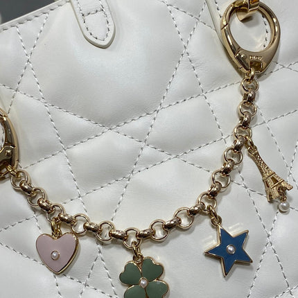 DIOR 25S TOUJOURS VERTICAL TOTE BAG 18 IN IVORY CALFSKIN WITH CHARM BRACELET STRAP