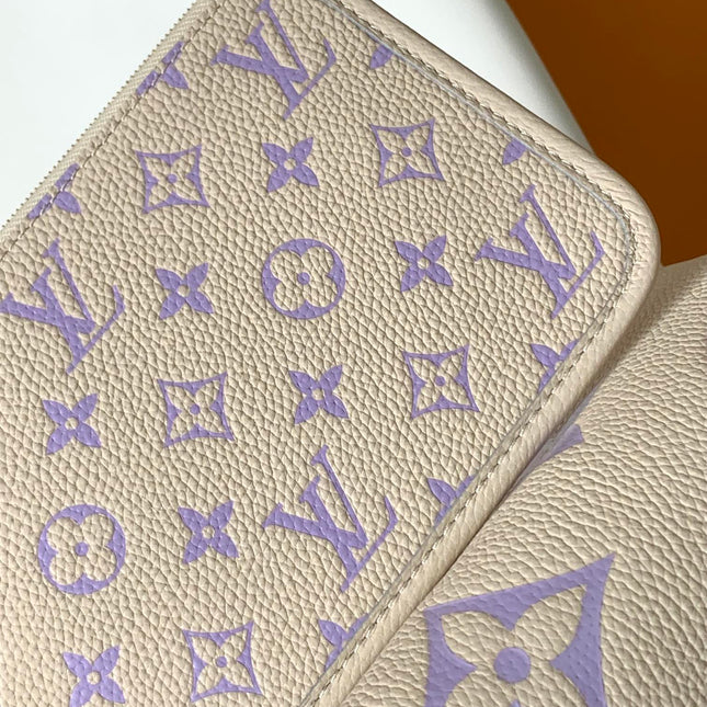 CARRYALL PM 29 BAG IN BEIGE MIX PURPLE MONOGRAM EMPREINTE LEATHER