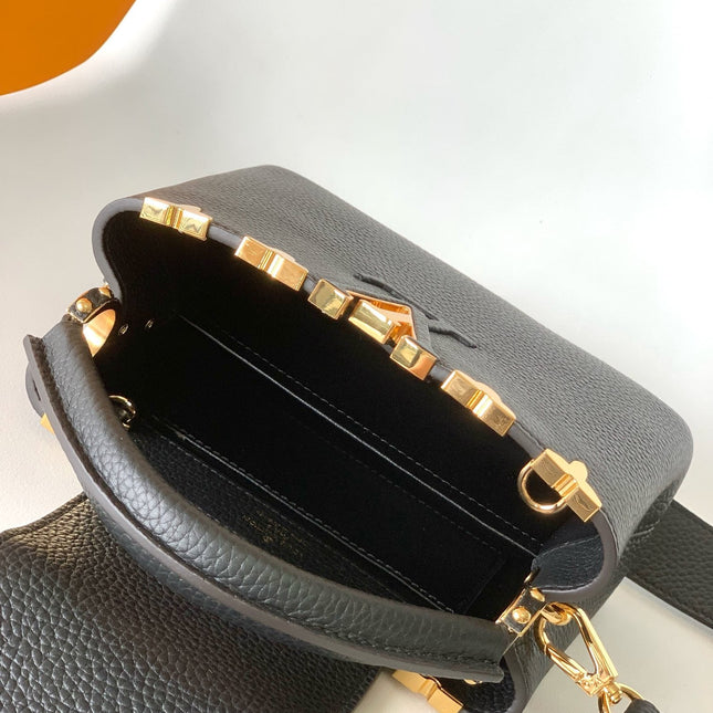 CAPUCINES MM BAG 21 IN BLACK TAURILLON COWHIDE GOLD HARDWARE
