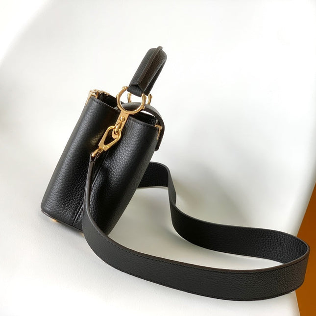 CAPUCINES MM BAG 21 IN BLACK TAURILLON COWHIDE GOLD HARDWARE