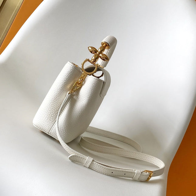 CAPUCINES EAST-WEST MINI 21 IN WHITE TAURILLON LEATHER GOLD-TONE HARDWARE