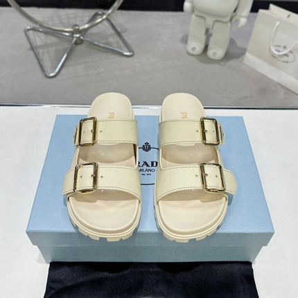 PRADA 25S STRAP SLIDES 30MM IN CREAM CALFSKIN GOLD HARDWARE