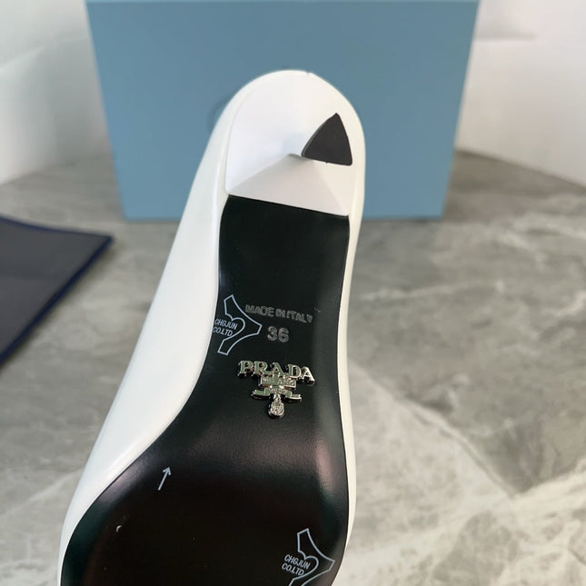 PRADA 25S METAL-CAPPED POINTED-TOE HIGH HEELS IN WHITE CALFSKIN