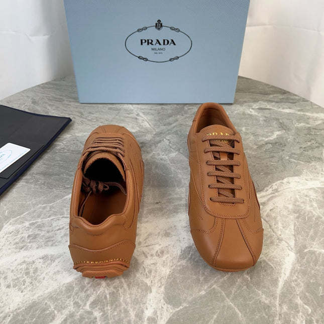 PRADA 25S MONTECARLO ANTIQUED SNEAKERS IN CARAMEL NAPPA LEATHER