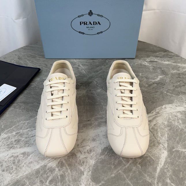PRADA 25S MONTECARLO ANTIQUED SNEAKERS IN CHALK WHITE NAPPA LEATHER