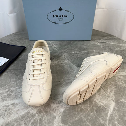 PRADA 25S MONTECARLO ANTIQUED SNEAKERS IN CHALK WHITE NAPPA LEATHER