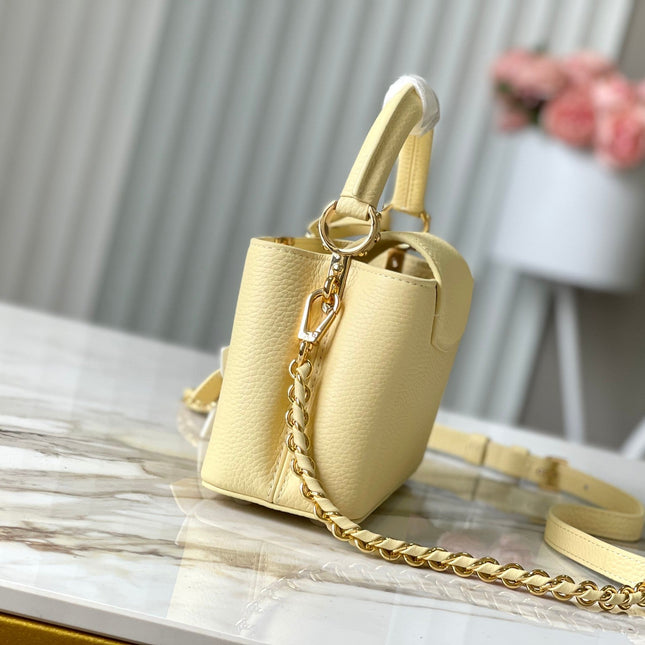 CAPUCINES EAST-WEST MINI 22 IN BANANA YELLOW TAURILLON GOLD HARDWARE