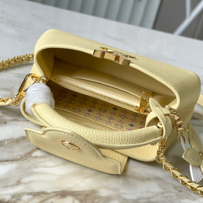 CAPUCINES EAST-WEST MINI 22 IN BANANA YELLOW TAURILLON GOLD HARDWARE