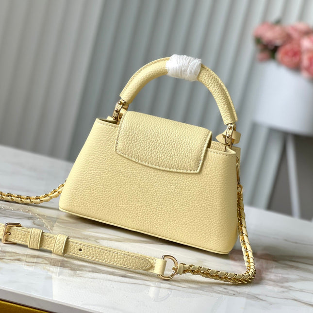 CAPUCINES EAST-WEST MINI 22 IN BANANA YELLOW TAURILLON GOLD HARDWARE