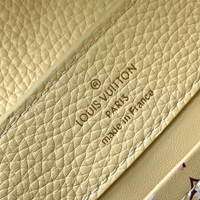 CAPUCINES EAST-WEST MINI 22 IN BANANA YELLOW TAURILLON GOLD HARDWARE