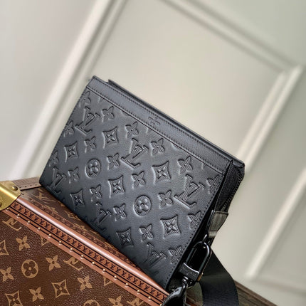 POCHETTE VOYAGE 22 IN BLACK MONOGRAM SHADOW CALFSKIN