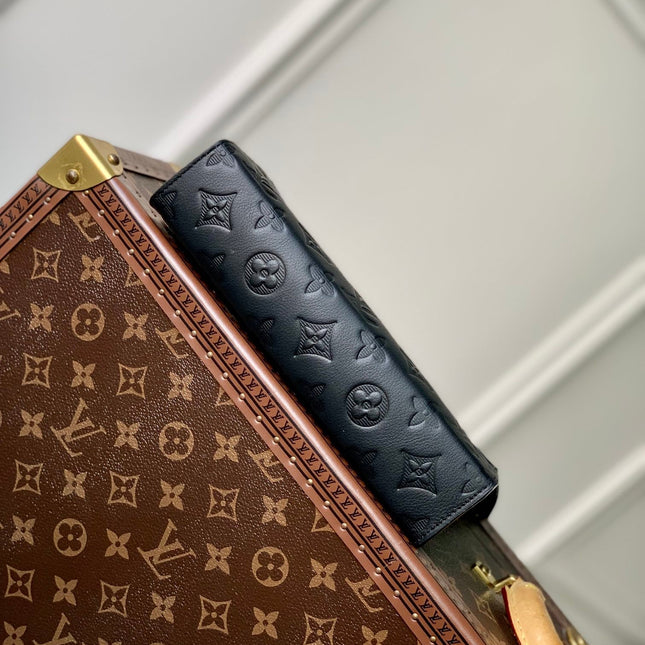 POCHETTE VOYAGE 22 IN BLACK MONOGRAM SHADOW CALFSKIN