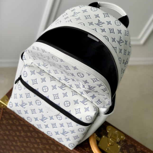 DISCOVERY PM BACKPACK 38 IN WHITE MONOGRAM LAMBSKIN