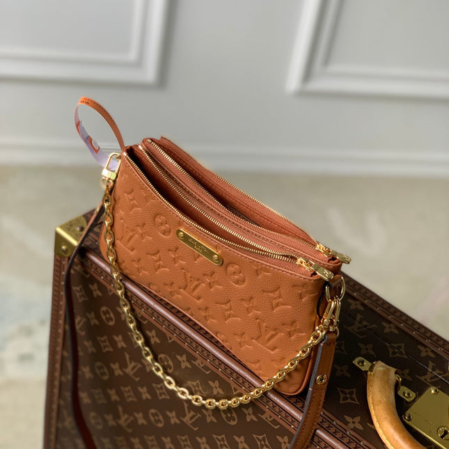 LIV POCHETTE BAG 24 IN COGNAC BROWN MONOGRAM EMPREINTE LEATHER