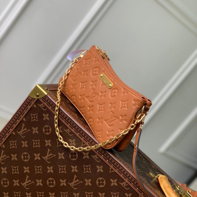 LIV POCHETTE BAG 24 IN COGNAC BROWN MONOGRAM EMPREINTE LEATHER