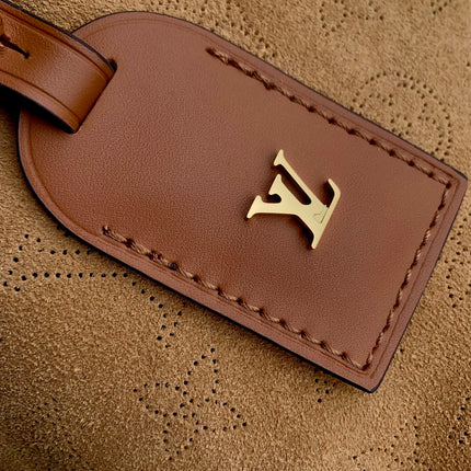 CARRYALL PM 29 IN CIDER BROWN MONOGRAM PERFORATED SUEDE AND WHITE SHEARLING TRIM