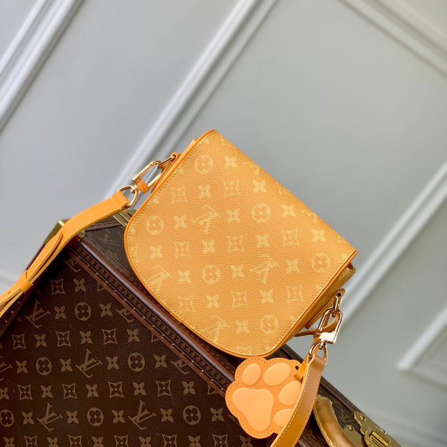 MONTSOURIS MESSENGER PM 20 IN PEPPER ORANGE MONOGRAM HERITAGE CANVAS