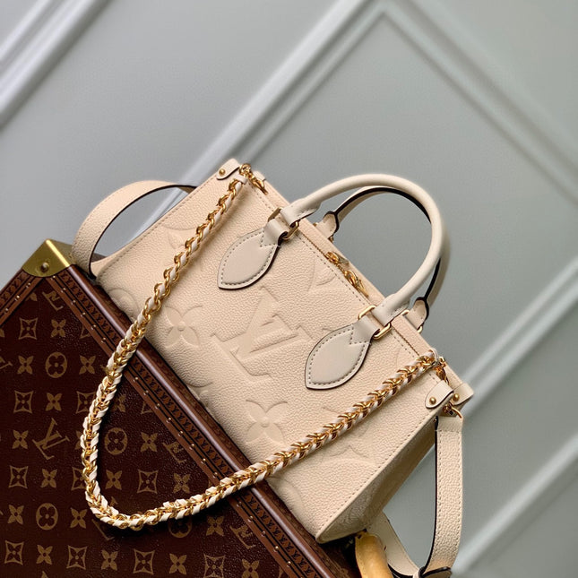 ONTHEGO EAST WEST BAG 25 IN BEIGE MONOGRAM EMBOSSED COWHIDE